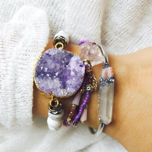 woman wearing druzy jewelry and Natural Pink Tourmaline and Angel Aura Quartz bracelet on her wrist