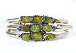 3 green peridot stone set in crushed pyrite bracelets with gold plated band